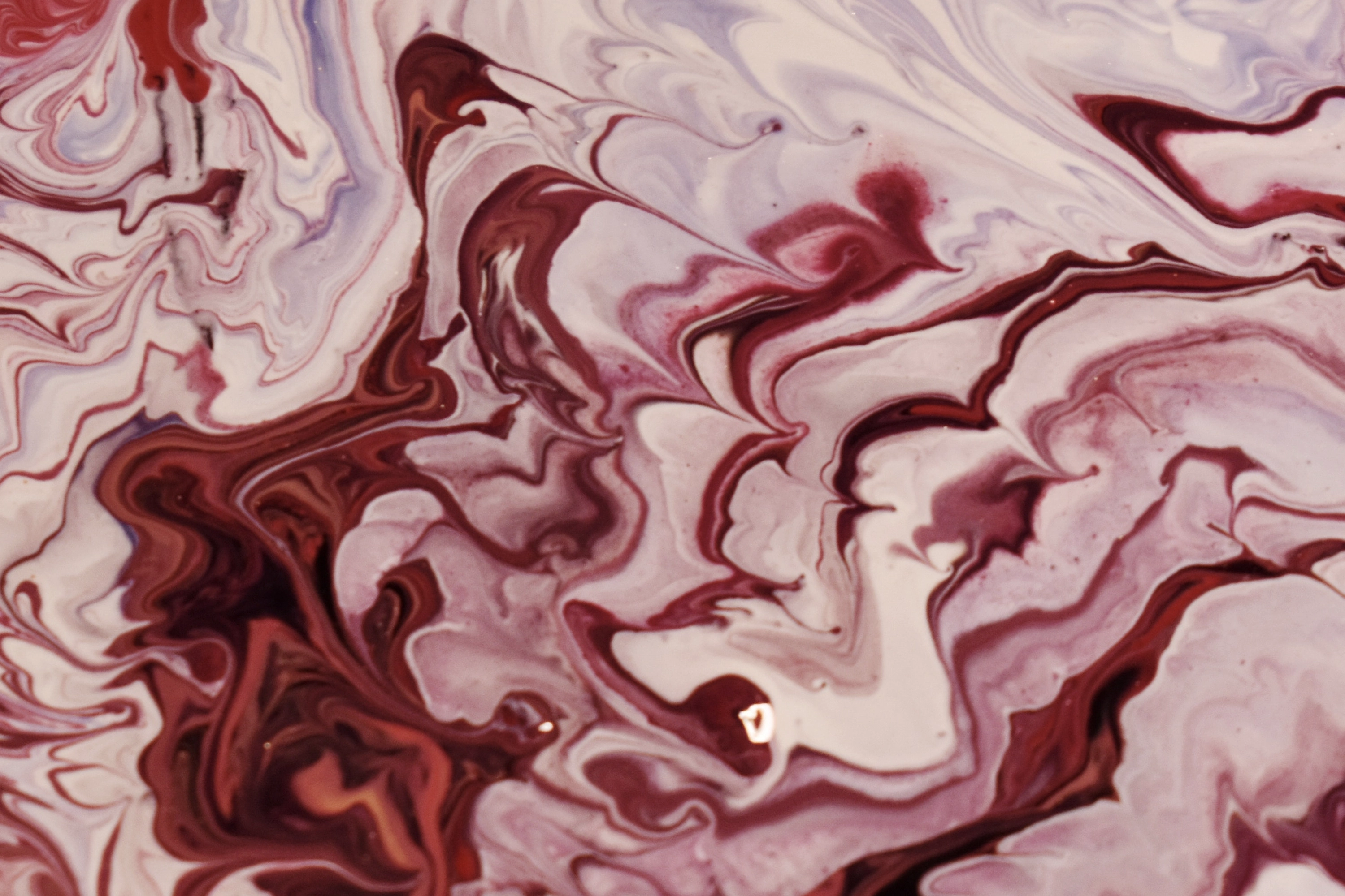 red and white swirl abstract painting